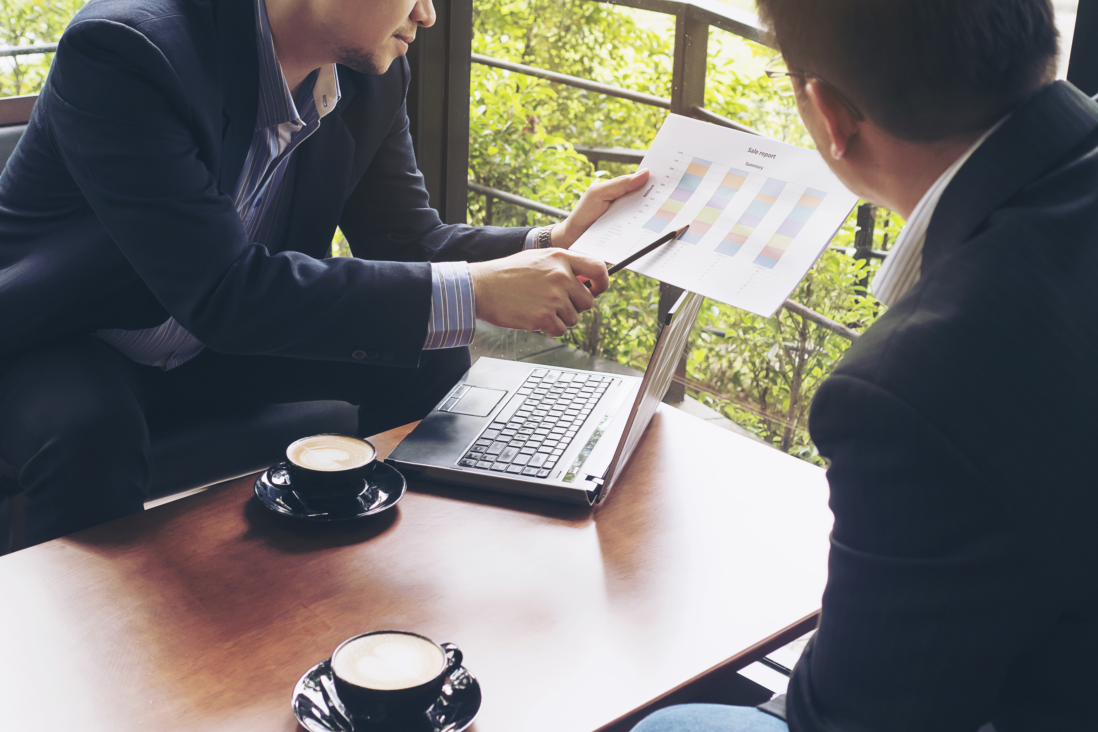 Advisor discussing options with client using a tablet